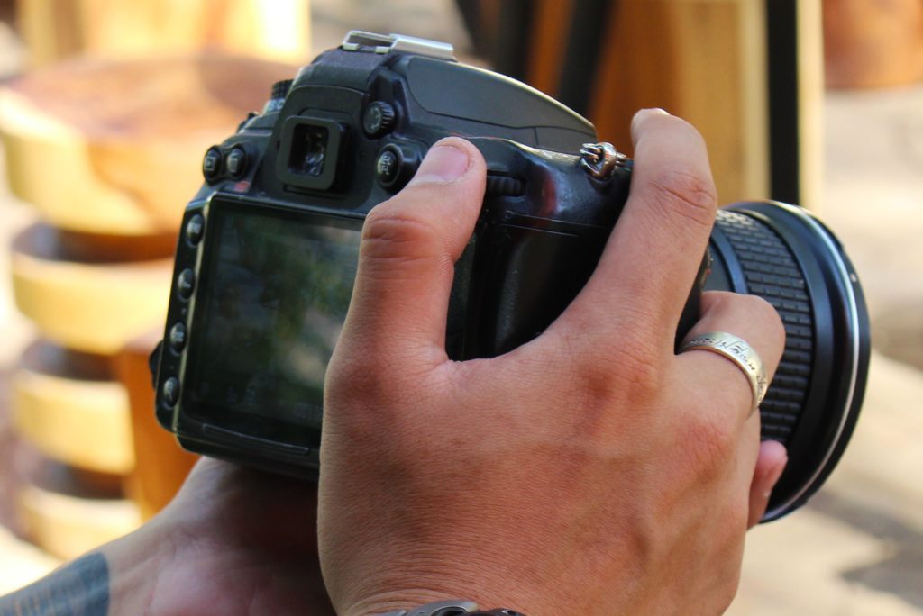 Person holding his camera for real estate photography