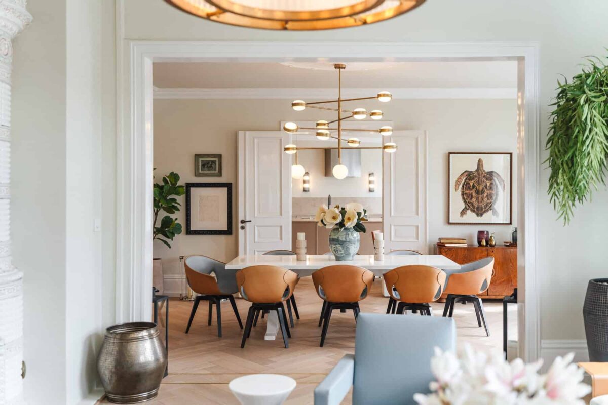 Modern dining room with unique dinner chairs and fancy looking ceiling lights