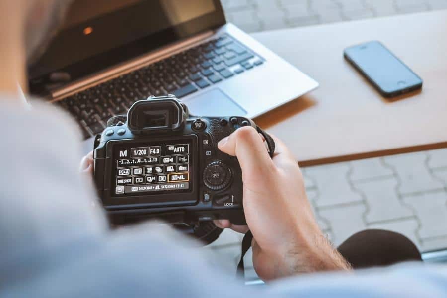 An image of a person changing the camera settings