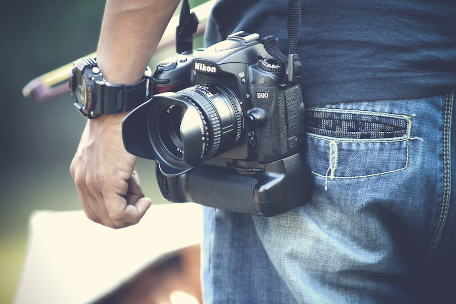 A person with a DSLR