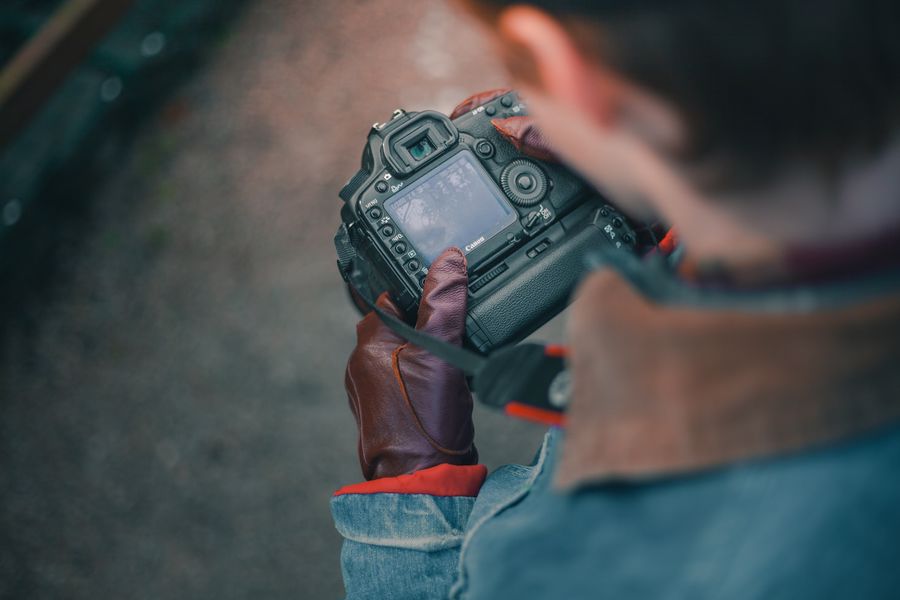 Man reviewing his photos on his camera