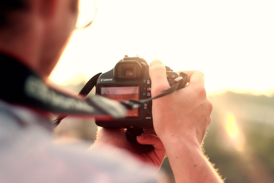 Man checking his DSLR screen
