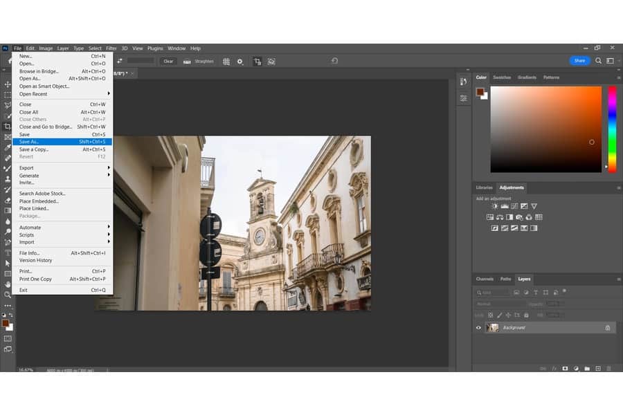 Save the Changes made in the image of the yellow architectural building on Adobe