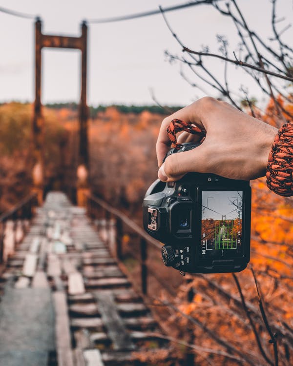 Person trying to take a photo of a scenery