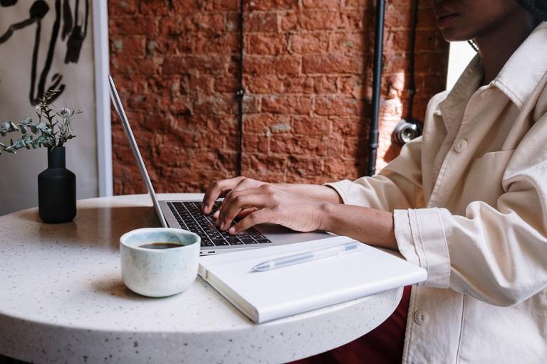 Woman using a laptop in a cafe