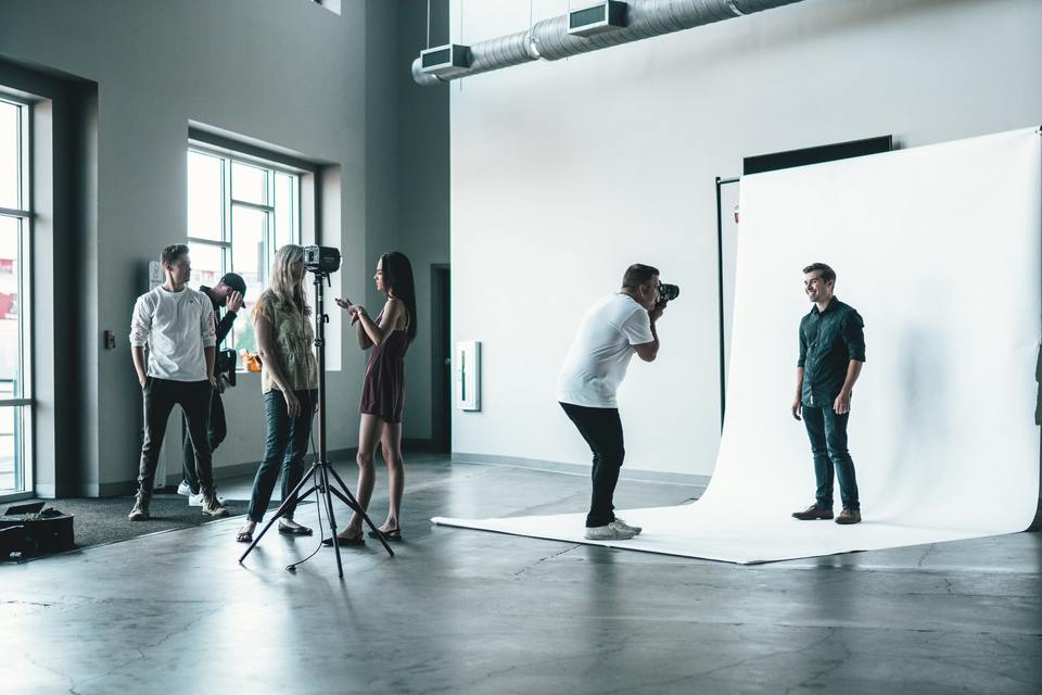 Photographer shooting portrait in studio
