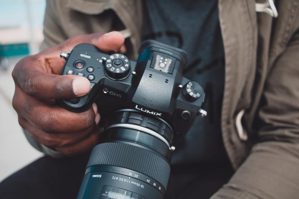 Man holding a DSLR camera