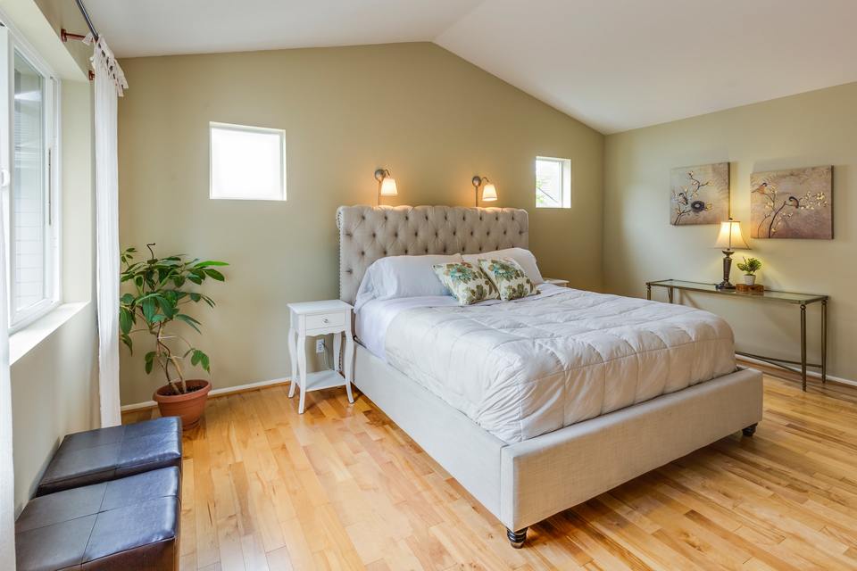 Bedroom with white upholstered bed