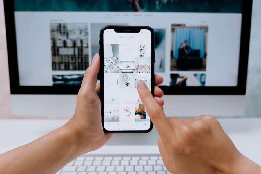 Person uploading real estate photos using a smartphone