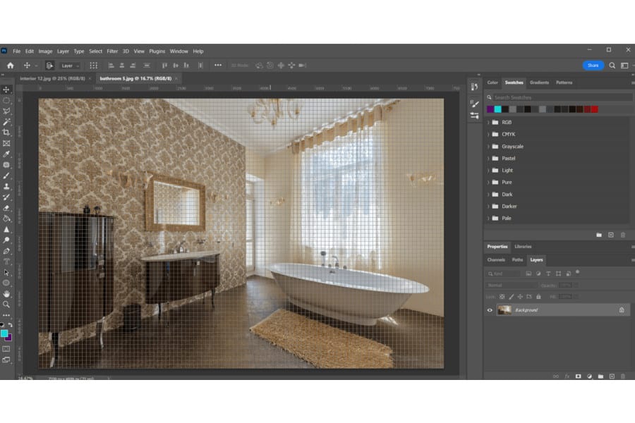A photo of a room with bathtub, mirror, table, and cabinet currently editing on Photoshop with grids and lines