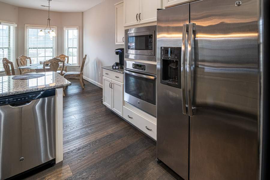 Kitchen with glossy countertops and appliances